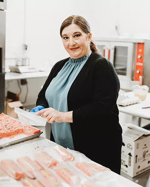 Jonna Nowakowski, who develops the baking recipes at Nature’s Key, packages THC-infused treats for patients. - ALEXA ACE