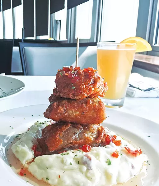 Confit fried chicken thighs finished in tomato jam are a new menu addition at 3Sixty Restaurant & Bar. - JACOB THREADGILL