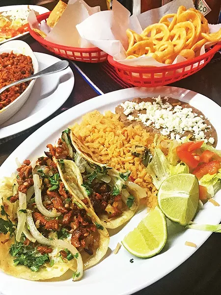 Tacos arabes filled with al pastor and cheese - JACOB THREADGILL