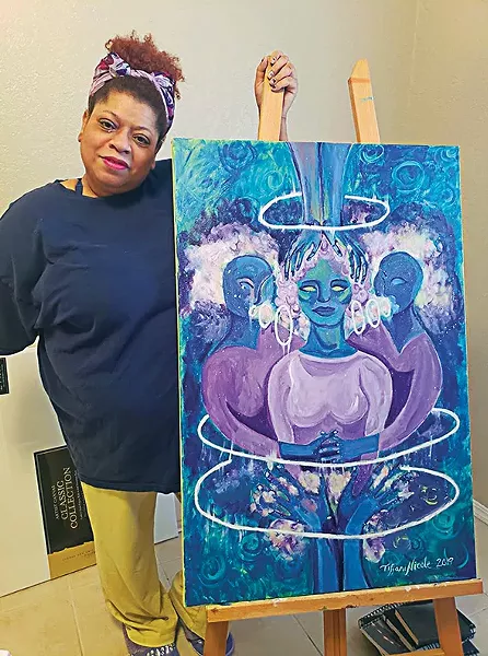 Tiffani Nicole Sanders with her painting “Safe Space” - OKLAHOMA CALL FOR REPRODUCTIVE JUSTICE / PROVIDED