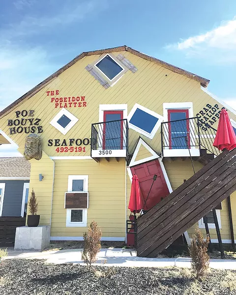 Owner Tony Howard spent four years building the unique facade on the exterior of Poe Bouyz House. - JACOB THREADGILL