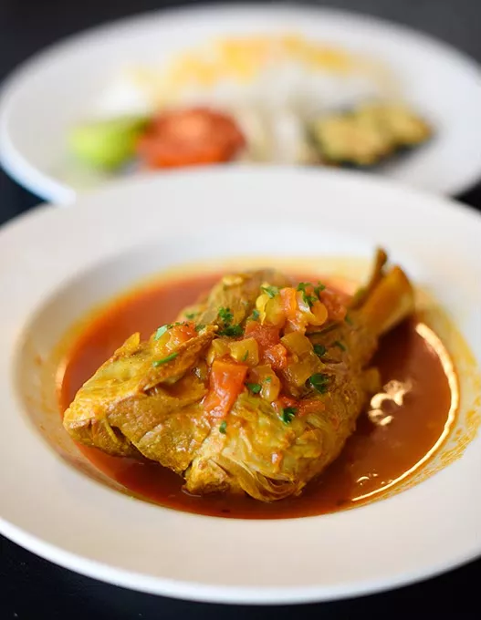 Lamb shank at Travel by Taste, Wednesday, March 9, 2016. - GARETT FISBECK