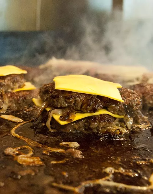 Double Onion Burger on the grill (Mark Hancock)