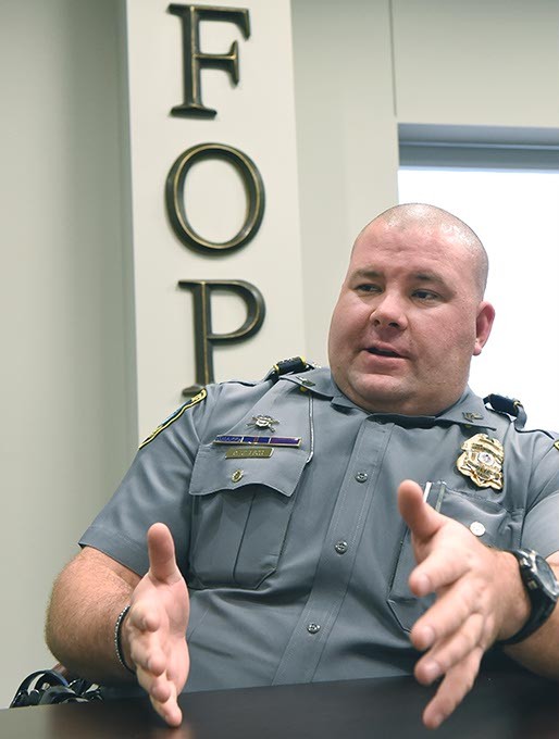 Sgt. Cody Koelsch tells stories of his police duties with the Oklahoma City Police Department during the Gazette interview, 12-11-15. - MARK HANCOCK