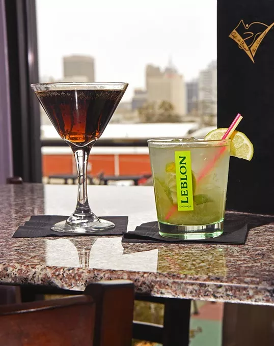 Specialty coctails including the popular Caipirinha, at right, with a view at the Bossa Nova Caipirinha Lounge in MidTown Oklahoma City, 1-22-16. - MARK HANCOCK