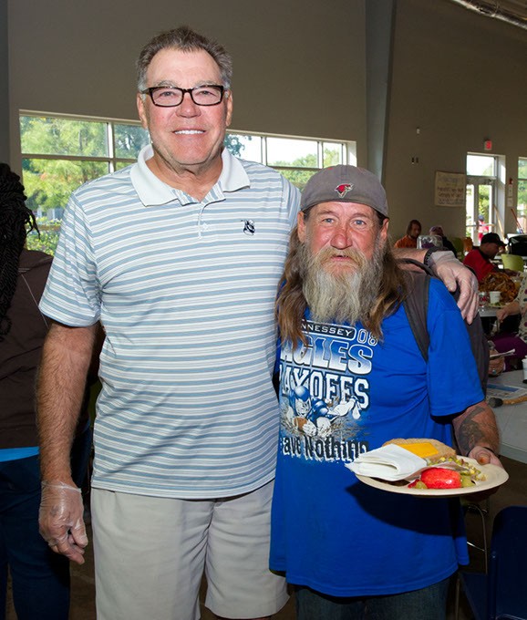 Steve Zabel poses for a photo with long time friend David Graves at the West Towne Resource and Day Shleter during lunch time. Photo/Shannon Cornman - SHANNON CORNMAN