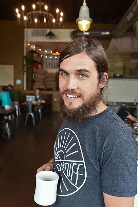 Co-owner Trey Woods at the Hoboken Coffee Roaster in Guthrie. mh