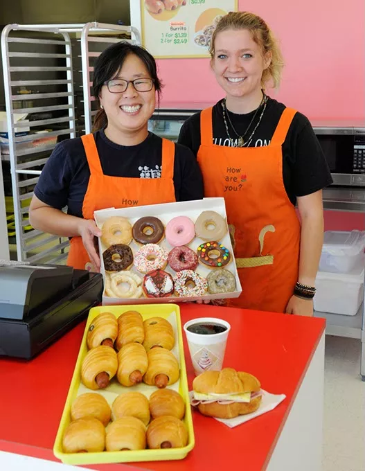 Katie Kang and Samantha Kimes poses for a photo at Donut Therapy in Oklahoma City, Thursday, Sept. 17, 2015. - GARETT FISBECK
