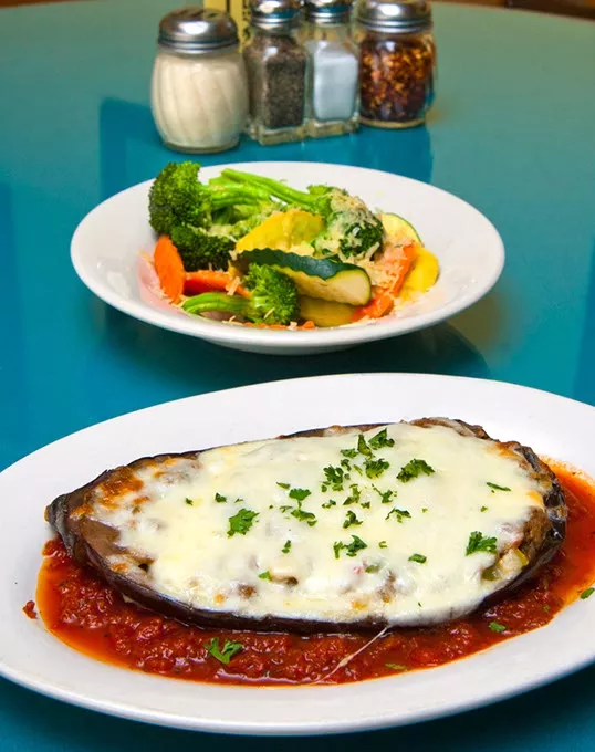 Baked Eggplant, this is the half dish, served with the generous veggie side dish, at Sergio's Italian Bistro in Norman. mh