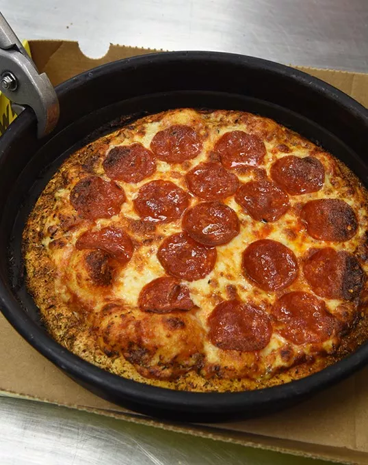 Get a personal pan baked pizza to go at Hungry Howies in Del City, of course they keep the pan, 9-23-15. - MARK HANCOCK
