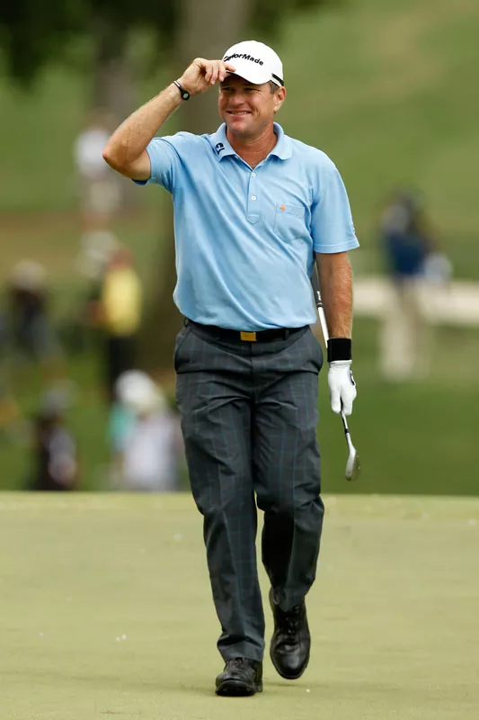 Scott Verplank smiles as he walks across the 16th green during the final round of the 93rd PGA Championship at the Atlanta Athletic Club on August 14, 2011 in Johns Creek, Georgia. - MIKE EHRMANN