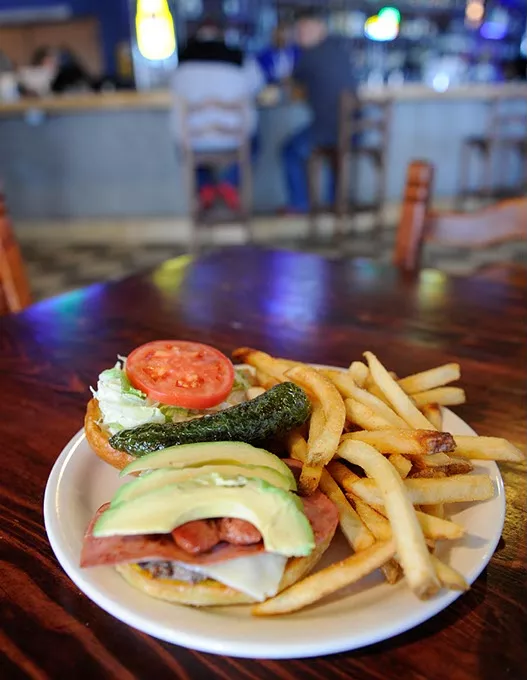 La Mexicana burger and fries at Medio Tiempo Sports Cantina and Grill in Oklahoma City, Friday, Feb. 6, 2015. - GARETT FISBECK