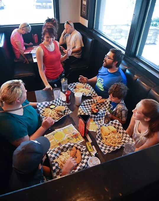 The Reid family group from Tulsa enjoys Louie's spacious accomodations, served by Kelly Menasco at the 412, S. Meridian Avenue location. mh