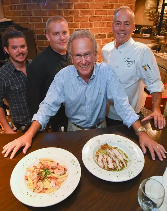 From left, Cody Stubblefield, Josh Tolle, Tommy Byrd (owner), and Tony Dorl, with Penne Arabiatta, left, and Cilantro Pesto Linguine, at Tommy's Italian-American Grill.