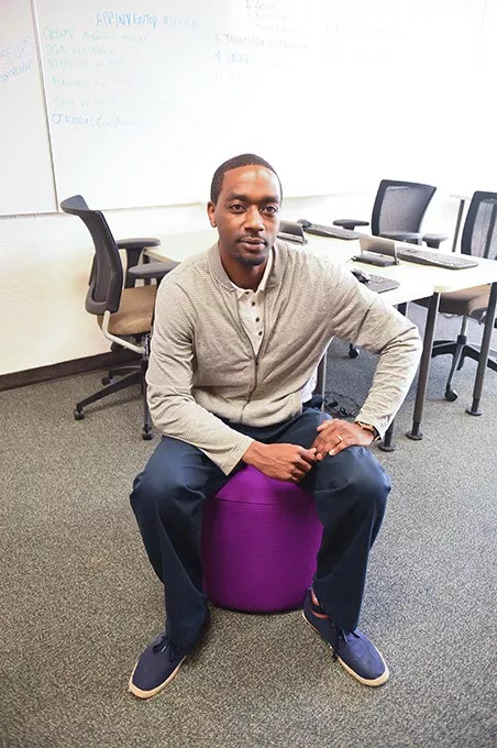 Jermaine Simpson, employment training manager at the Urban League of Greater OKC, photographed on one of the colorful atamans in the Dell Collaborative Learning Lab at the Urban League. mh