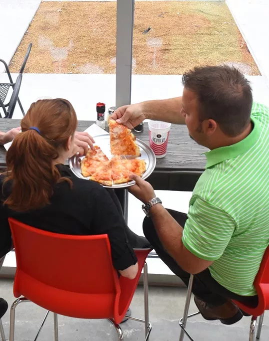 Patrons at the downtown location for Revolve Pizza Kitchen can sit in the window and watch the downtown world go by, 7-21-2015. File - MARK HANCOCK