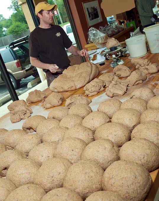 Rolling dough into balls for bread baking, at Big Sky Bread Company. (Mark Hancock)
