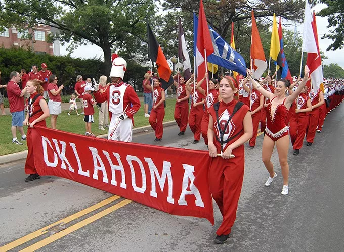 The Pride of Oklahoma marching band marches towards Memorial Stadium for the OU vs Miami football game, 9-8-2007. - MARK HANCOCK