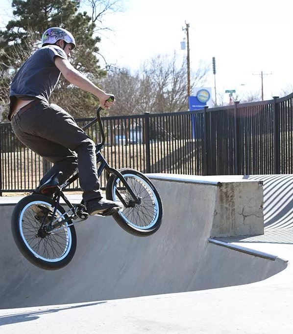 18 year old Brandon Michell wears his helmet when he goes for a fly on his bike at the Mat Hoffman Action Sports Park in Oklahoma City, 2-17-16. - MARK HANCOCK