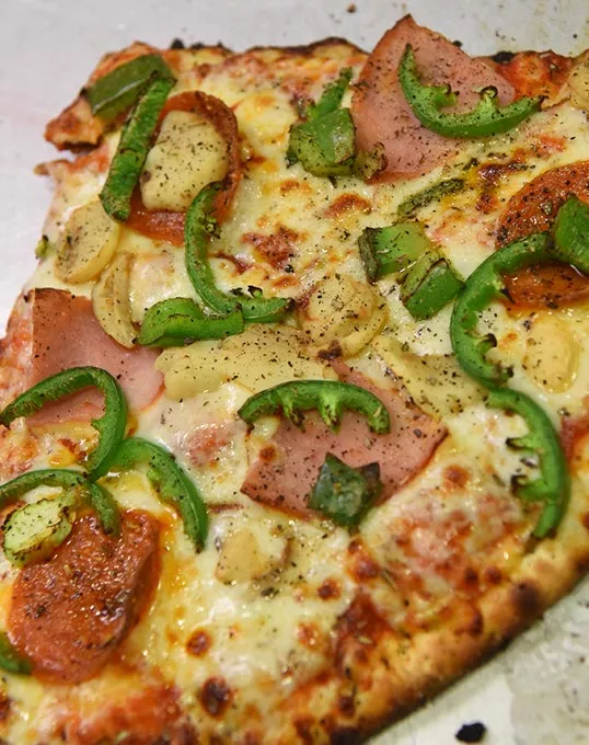Build your own pizza, in halves, quarters, and wholes, at Crooked Crust, 757 Asp Ave., in Norman, 11-16-15. - MARK HANCOCK