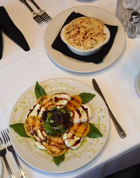 Lobster Cargot appetizer, top, and the Caprese salad at Mickey Mantle's in Bricktown. mh