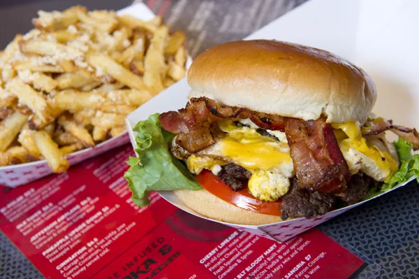 The Egg-O-Nater with bacon and a side of garlic and parmesan french fries at The Garage.Photo/Shannon Cornman - SHANNON CORNMAN