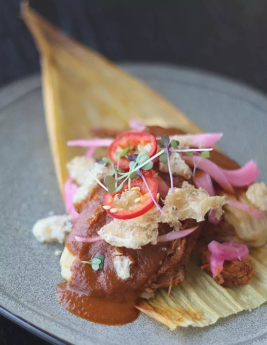 Red Chili Pork Tamale with mole manchemanteles and chicharrón at Barrios Fine Mexican Dishes. (Cara Johnson).