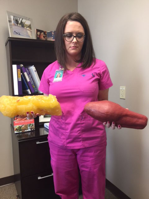 Dietician Tiffany Poe holds fat in one hand and muscle, which is more efficient at burning calories, in the other. (Terre Cooke Chaffin)