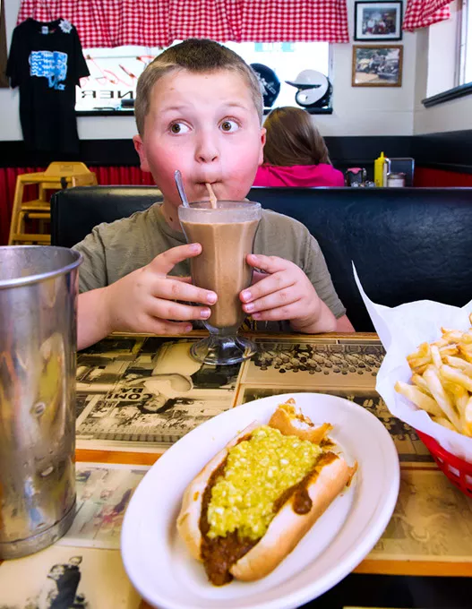 Bradynn Hall slurps down a peanut butter chocolate shake at Sid's Diner in El Reno.Photo/Shannon Cornman - SHANNON CORNMAN