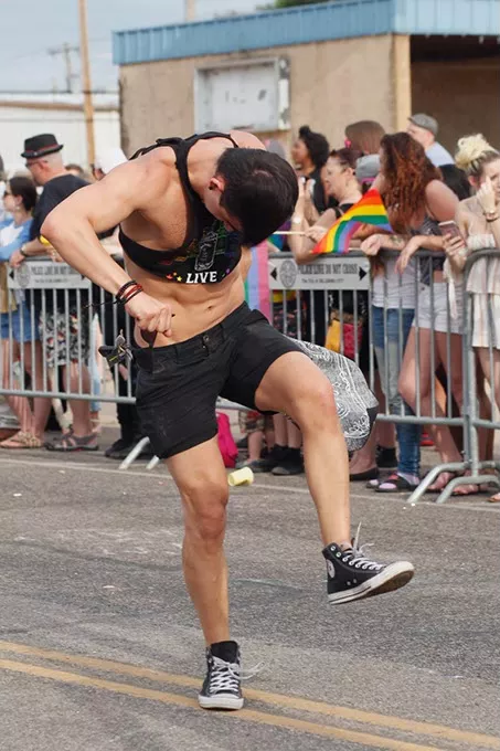 A man dances doown 39th St. during the Pride Parade on Sunday, June 25, 2017. (Cara Johnson).