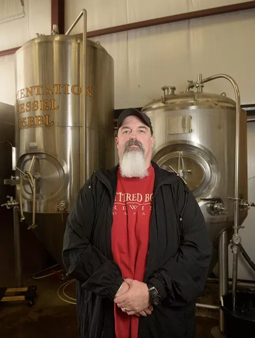 Mike Sandefur poses for a photo at Battered Boar Brewing Company, Monday, June 5, 2017. - GARETT FISBECK
