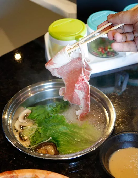 Shabue Shabu at Muu Shabu in Edmond, Friday, June 17, 2016. - GARETT FISBECK
