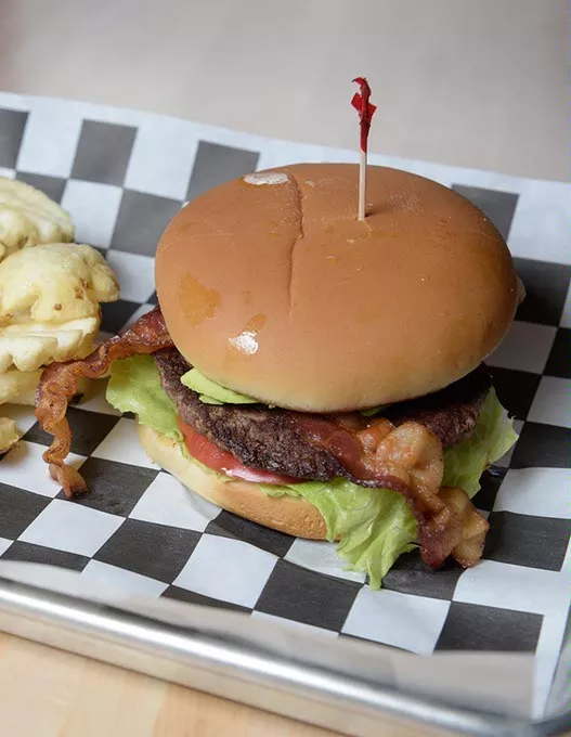 Aikman Bacon Avacado Burger with Waffle Fries at 1907 Burgers & Brews in Moore, Friday, Sept. 23, 2016. - GARETT FISBECK