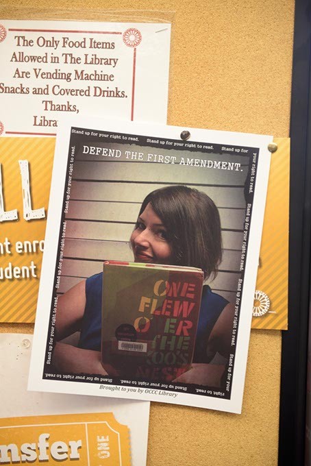 Fliers around the Oklahoma City Community College campus show staff posing with their favorite banned books. (Garett Fisbeck)