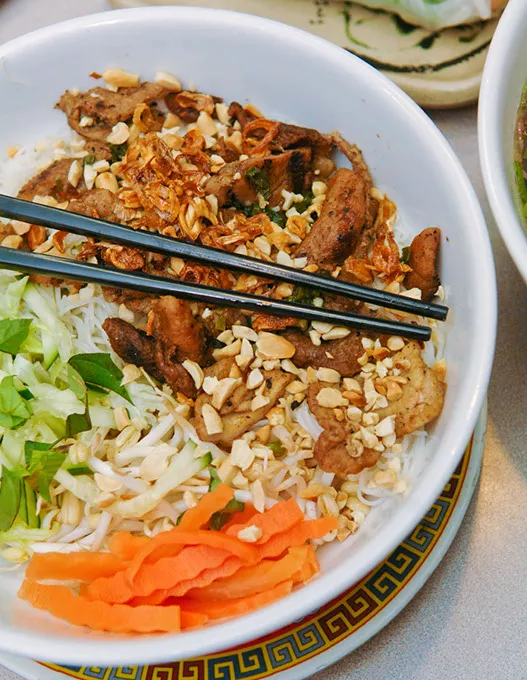 Vermacelli bun bowl with chicken, peanuts and vegetables at Pho CA Dao.Photo/.Shannon Cornman - .SHANNON CORNMAN