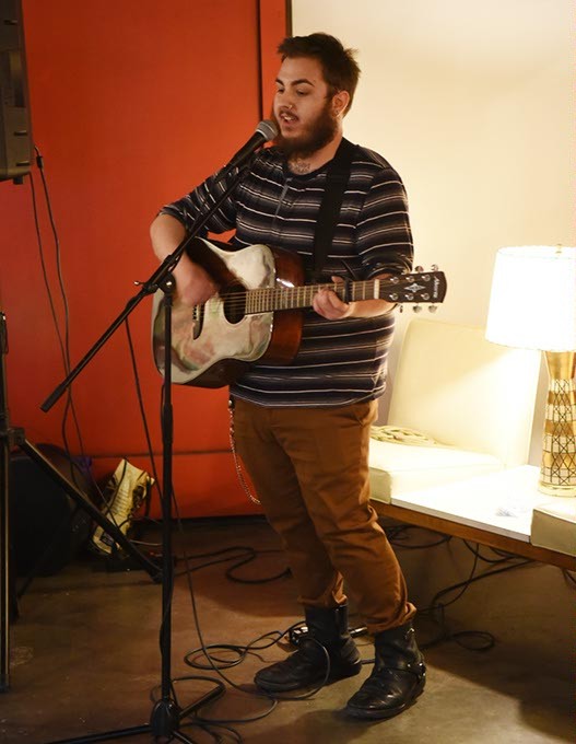 Parker Cunningham, at District House in the Plaza District, where he performed songs while his mother, author Sarah Cunningham did a reading and book signing event, 1-27-15.  mh