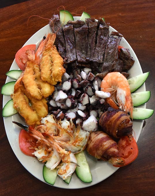 The Mar y Tierra, "land and sea" dish, with octopus in the center, surrounded by creatures from both land and sea, including shrimp wraped with bacon, at Mariscos Mazatlan on South Robinson Avenue in Oklahoma City, 1-27-16. - MARK HANCOCK
