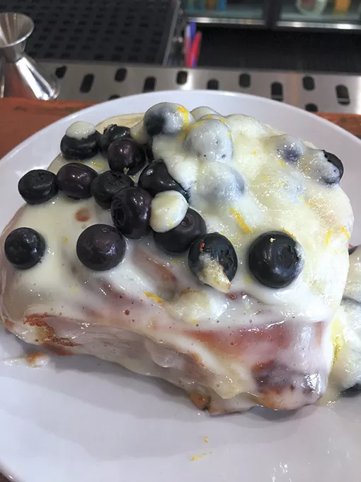 The citrus vanilla cinnamon roll with fresh blueberries is one of three varieties only available on the weekend. - JACOB THREADGILL