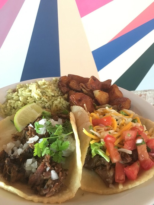 Street- and Tex-Mex-style tacos are joined by green rice and roasted potatoes. - JACOB THREADGILL