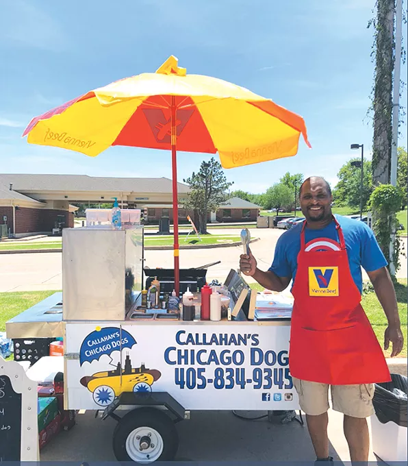 Dewayne Callahan stands near his hot dog truck in a photo that garnered over 115,000 retweets on Twitter. - PROVIDED