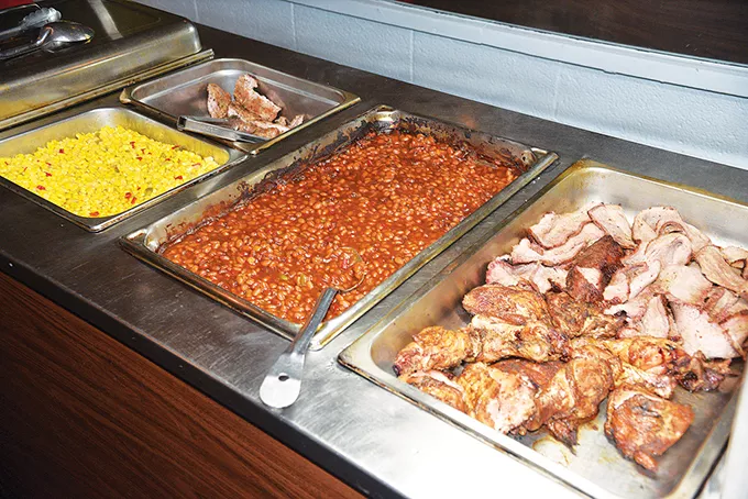 The Wednesday barbecue buffet features brisket, chicken and - country-style pork ribs along with corn, beans and other sides. - JACOB THREADGILL