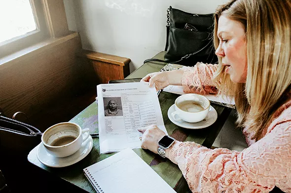Lauren Layman looks through the criminal records of her great-grandmother’s suspected killer. - ALEXA ACE