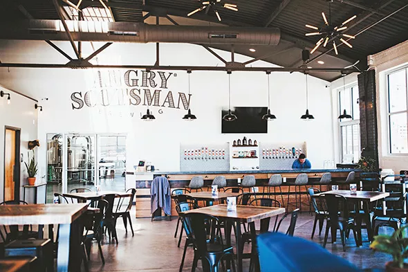 Angry Scotsman’s new taproom boasts an airy and inviting space and 24 beer taps. - ALEXA ACE
