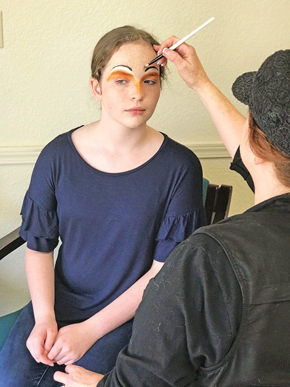 Emma Poindexter has makeup done by makeup artist Brawna Gfeller. - PROVIDED