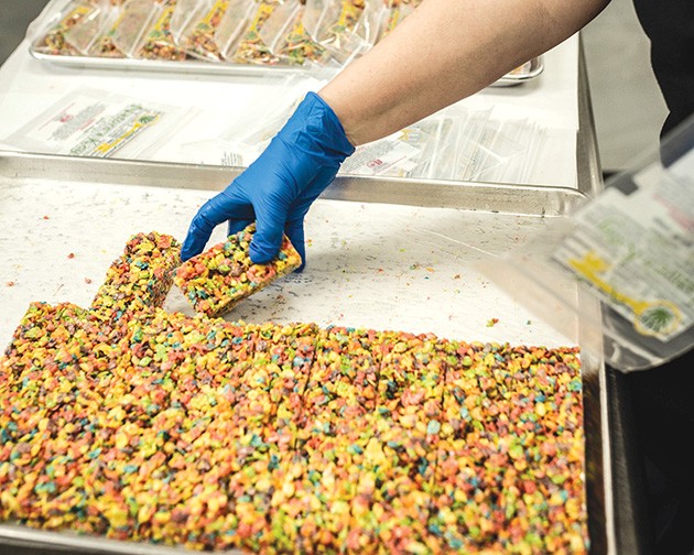A pan of THC-infused crispy treats being packaged at Nature’s Key - ALEXA ACE