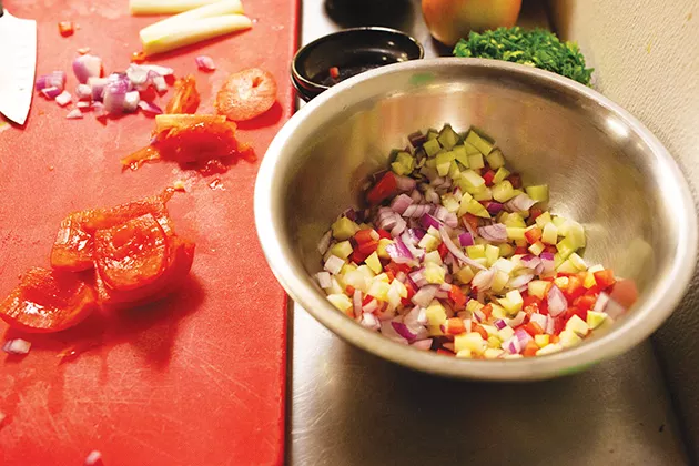 Ingredients of the ceviche are mixed together with cannabis-infused cilantro olive oil to create the medicated taco. - ALEXA ACE