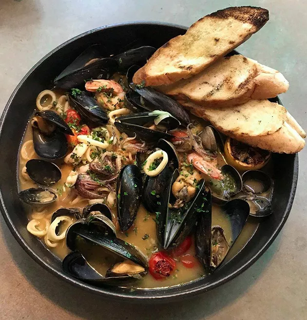 Traditional French bouillabaisse gets a touch of cream to be served Moroccan-style with mussels, clams, shrimp and squid.