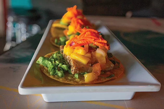Tuna tostadas topped with mango salsa made with cannabis-infused chili oil - ALEXA ACE