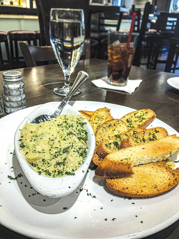 Artichoke dip appetizer at Bellini’s - JACOB THREADGILL