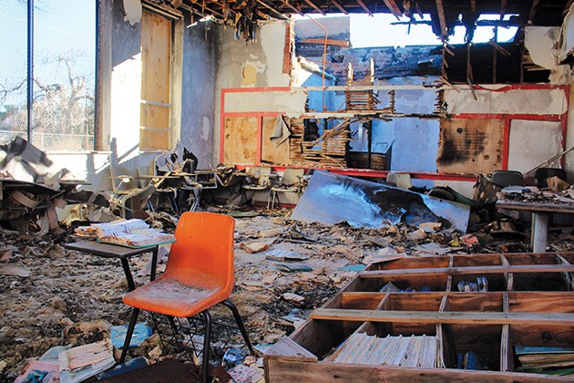 Before historic Dunjee School in Spencer burned down in 2012, it still held furniture and schoolbooks as well as personal items from its caretaker and former student Theotis Payne, who had reopened the building as a school for at-risk youth in 1998. - MICHAEL SCHWARZ / ABANDONED OKLAHOMA / PROVIDED